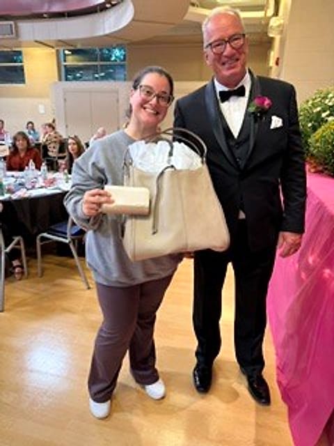 A bingo winner with her new handbag